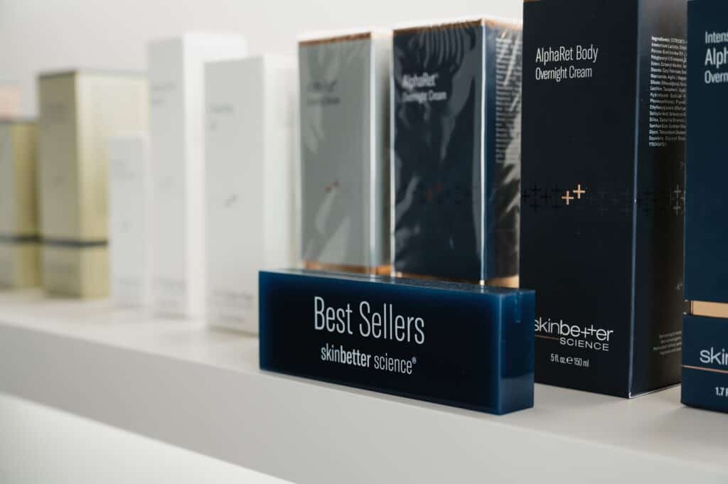 Skin care products on display shelf.