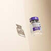 Botox Cosmetic vial with purple cap floating