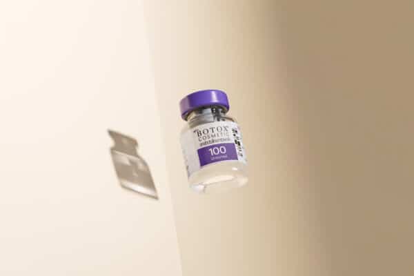Botox Cosmetic vial with purple cap floating