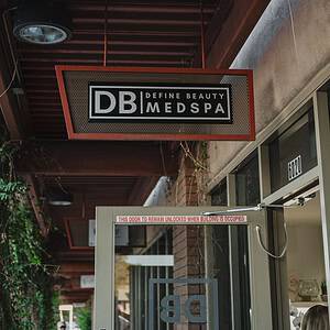 Define Beauty Medspa entrance sign and glass door