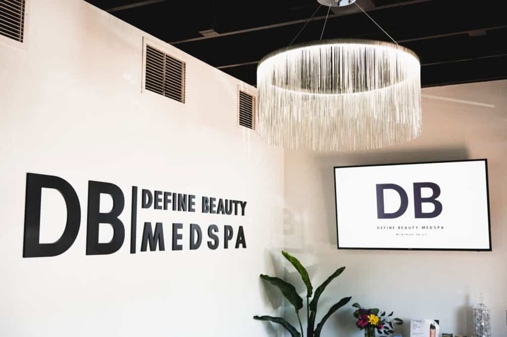 Define Beauty Medspa interior with wall sign and decor.
