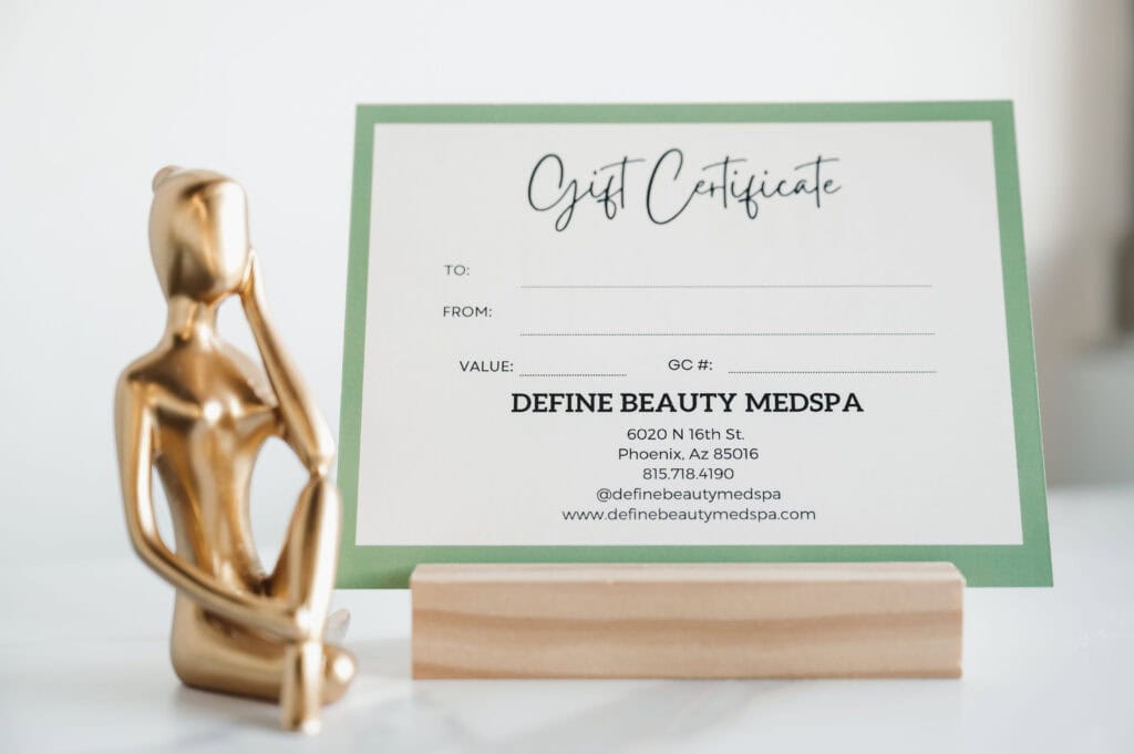 Define Beauty Medspa gift certificate with sculpture