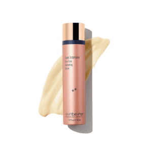 Skin tone correcting serum bottle with beige smear.